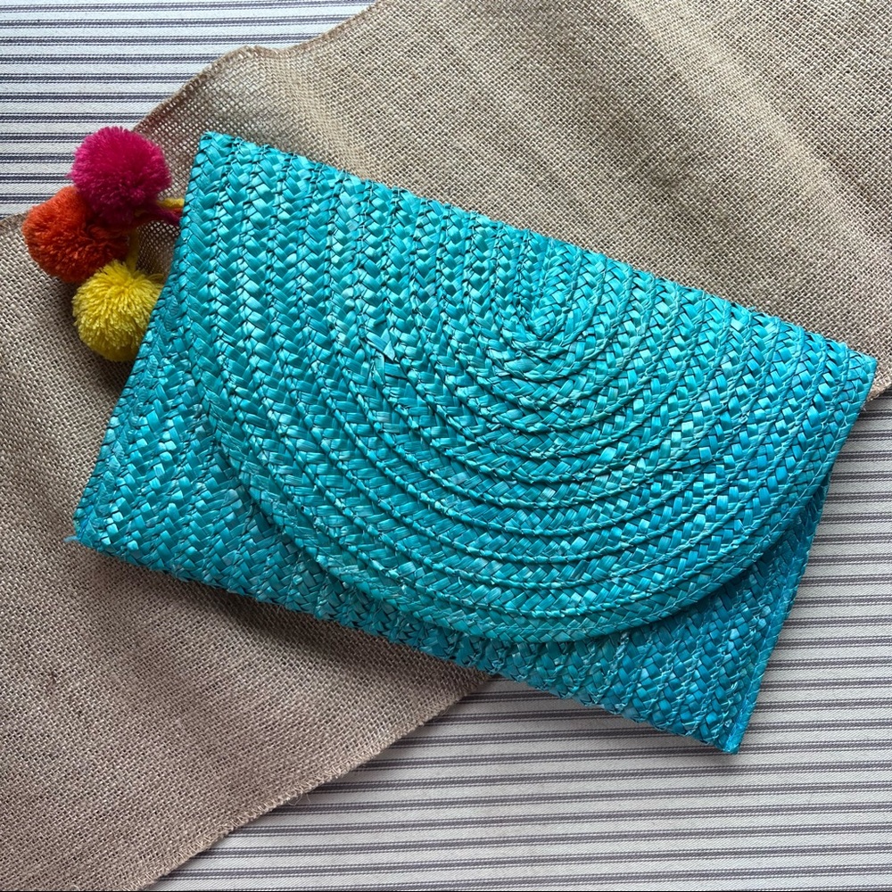 Turquoise beach clutch with pom poms